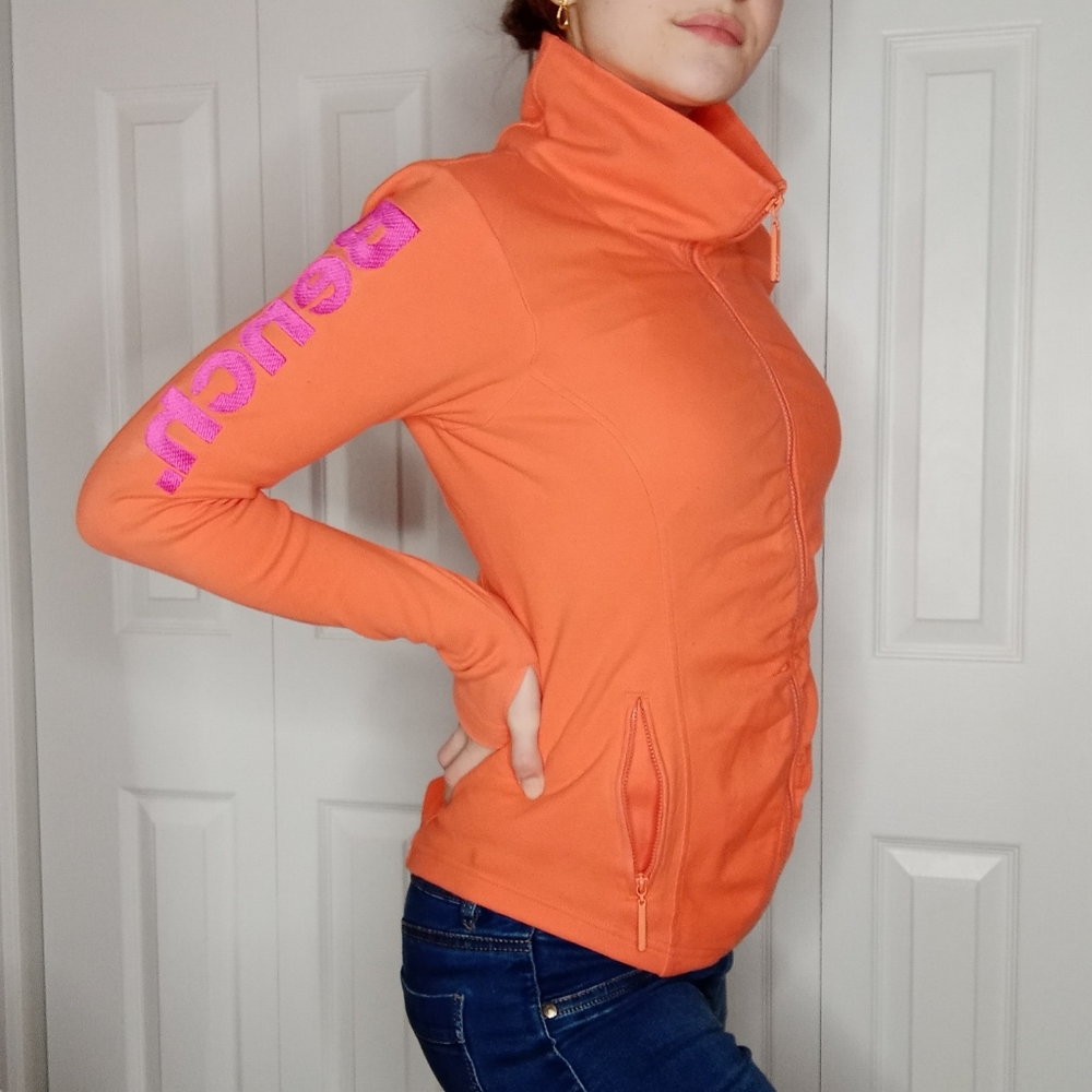 Orange 'Bench.' Zip up long sleeve sweater
